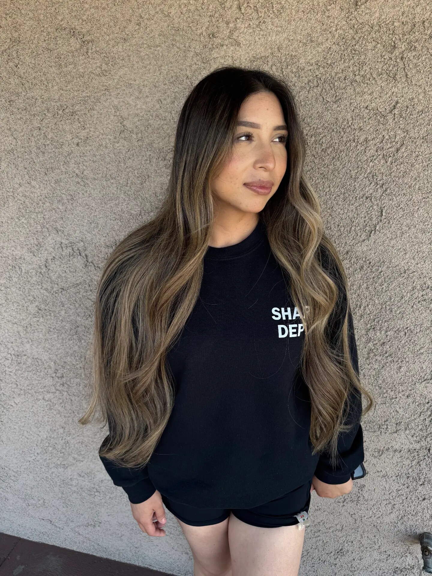 Very long dark brown hair with blonde balayage waves