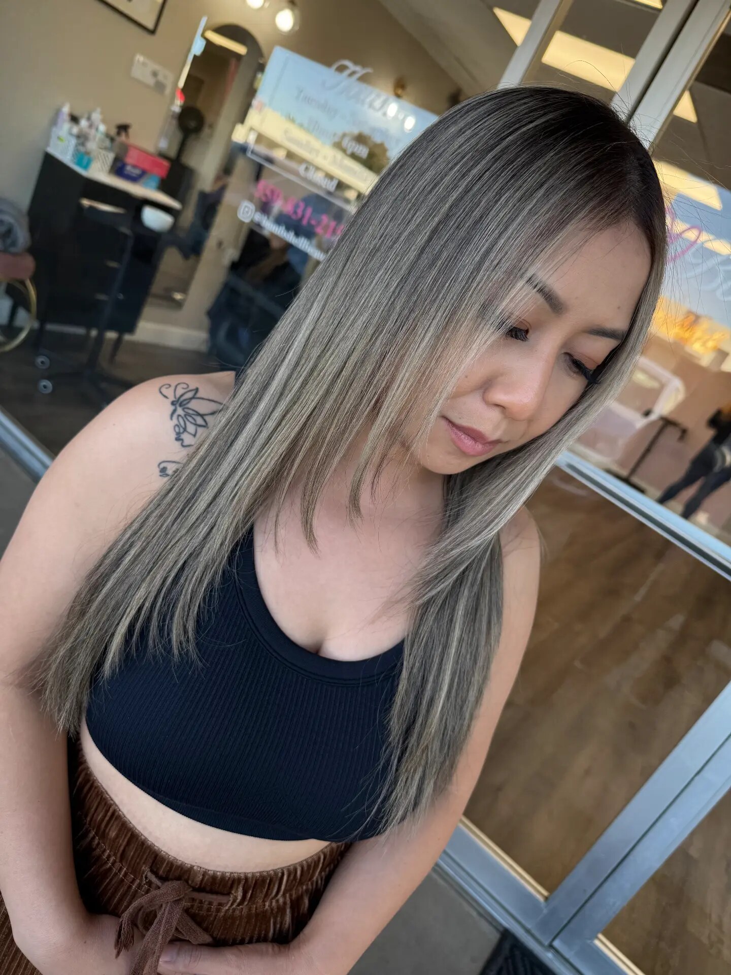 Long straight ash-blonde highlighted hair