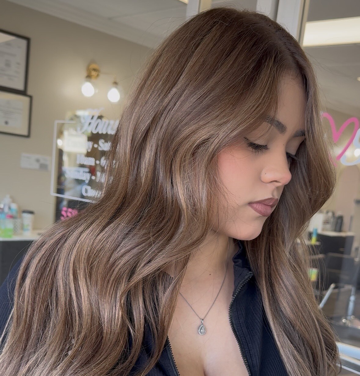 Long wavy caramel hair shown from the side