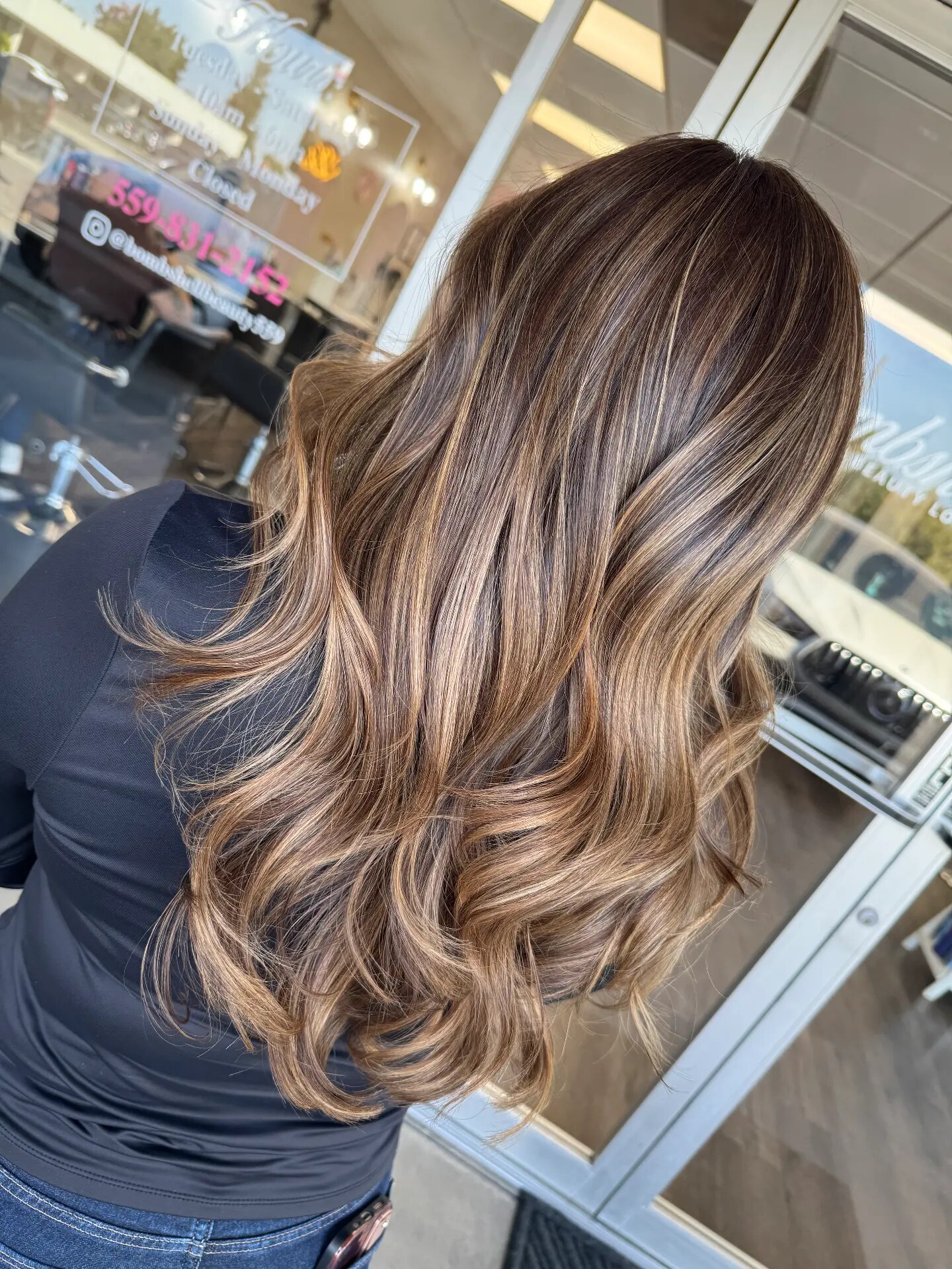 Long wavy brunette hair with caramel highlights